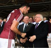 8 July 2018; The Galway captain David Burke is congratulated by President Michael D Higgins and Jim Bolger, Leinster GAA Chairman, centre, after the presentstion of the Bob O'Keeffe Cup after the Leinster GAA Hurling Senior Championship Final Replay match between Kilkenny and Galway at Semple Stadium in Thurles, Co Tipperary. Photo by Ray McManus/Sportsfile