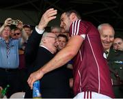 8 July 2018;  President Michael D Higgins congratulates Galway captain David Burke as he arrives for the presentation of the Bob O'Keeffe Cup after the Leinster GAA Hurling Senior Championship Final Replay match between Kilkenny and Galway at Semple Stadium in Thurles, Co Tipperary. Photo by Ray McManus/Sportsfile