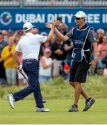 8 July 2018; Russell Knox of Scotland sinks a birdie putt to win the play-off hole and is congratulated by his caddie James Williams on Day Four of the Dubai Duty Free Irish Open Golf Championship at Ballyliffin Golf Club in Ballyliffin, Co. Donegal. Photo by John Dickson/Sportsfile