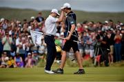 8 July 2018; Russell Knox of Scotland celebrates with his caddie James Williams after his winning birdie putt on the 18th green during Day Four of the Dubai Duty Free Irish Open Golf Championship at Ballyliffin Golf Club in Ballyliffin, Co. Donegal. Photo by Oliver McVeigh/Sportsfile