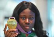 9 July 2018; Ireland's Rhasidat Adeleke, Tallaght AC, Dublin, with her gold medal for winning the Girls 200m event, during the Team Ireland homecoming from the European Athletics Under-18 Championships in Gyor, Hungary, at Dublin Airport in Dublin. Photo by Piaras Ó Mídheach/Sportsfile