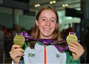 9 July 2018; Ireland's Sarah Healy, Blackrock AC, Dublin, with her gold medals for winning the Girls 1500m and 3000m events, during the Team Ireland homecoming from the European Athletics Under-18 Championships in Gyor, Hungary, at Dublin Airport in Dublin. Photo by Piaras Ó Mídheach/Sportsfile