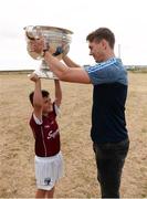 10 July 2018; Michael Fitzsimons of Dublin with Liam Conneely, aged 9, from Barna, Co. Galway, during a visit to Aran Islands GAA club prior to the GAA Hurling and Football All Ireland Senior Championship Series National Launch at the Aran Islands, Co Galway. Photo by Diarmuid Greene/Sportsfile