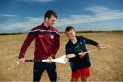 10 July 2018; Johnny Coen of Galway with Cian Dillane, aged 10, from Inis Mór, Co. Galway, during a visit to Aran Islands GAA club prior to the GAA Hurling and Football All Ireland Senior Championship Series National Launch at the Aran Islands, Co Galway. Photo by Diarmuid Greene/Sportsfile