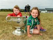 10 July 2018; Darragh Ó Flaherta, aged 8 months, and Éabha Ní Fhlaithearta, aged 5, with the Sam Maguire cup during a visit to Aran Islands GAA club prior to the GAA Hurling and Football All Ireland Senior Championship Series National Launch at the Aran Islands, Co Galway. Photo by Diarmuid Greene/Sportsfile