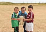 10 July 2018; Jack O'Connell aged 8, Senan Guildea, aged 12, and Liam Conneely, aged 9, with the Liam Mac Carthy cup during a visit to Aran Islands GAA club prior to the GAA Hurling and Football All Ireland Senior Championship Series National Launch at the Aran Islands, Co Galway. Photo by Diarmuid Greene/Sportsfile