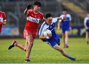 13 July 2018; Donnach Swinburne of Monaghan in action against Iarlaith Donaghy of Derry during the Electric Ireland Ulster GAA Football Minor Championship Final match between Derry and Monaghan at the Athletic Grounds, Armagh. Photo by Oliver McVeigh/Sportsfile