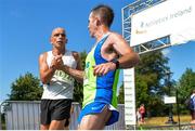 14 July 2018; Peter Walsh, left, congratulates John McMenamin of Metro/St. Brigids AC after crossing the line after the Irish Runner 10 Mile at Phoenix Park in Dublin. Photo by Eoin Smith/Sportsfile