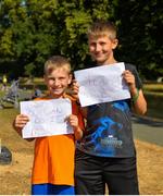 14 July 2018; Samuel, left, and Luke Bosse from Mayo supporting their mother Michelle Bosse during the Irish Runner 10 Mile at Phoenix Park in Dublin. Photo by Eoin Smith/Sportsfile