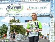 14 July 2018; Marie Nolan with the over 55 male and female trophies following the Irish Runner 10 Mile at Phoenix Park in Dublin. Photo by Eoin Smith/Sportsfile