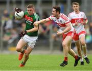 14 July 2018; Conor Diskin of Mayo in action against Pádraig McGrogan of Derry during the EirGrid GAA Football All-Ireland U20 Championship Semi-Final match between Mayo and Derry at Páirc Seán Mac Diarmada, in Carrick-on-Shannon. Photo by Piaras Ó Mídheach/Sportsfile