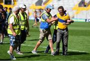 14 July 2018; A Clare supporter is restrained by stewards after encroaching onto the pitch after the GAA Hurling All-Ireland Senior Championship Quarter-Final match between Clare and Wexford at Páirc Ui Chaoimh in Cork. Photo by Brendan Moran/Sportsfile