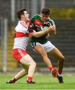 14 July 2018; Tommy Conroy of Mayo in action against Pádraig McGrogan of Derry during the EirGrid GAA Football All-Ireland U20 Championship Semi-Final match between Mayo and Derry at Páirc Seán Mac Diarmada, in Carrick-on-Shannon. Photo by Piaras Ó Mídheach/Sportsfile