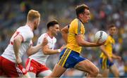 14 July 2018; Enda Smith of Roscommon bursts past Tyrone players Hugh Pat McGeary, left, and Pádraig Hampsey on his way to score a goal,  in the 39th minute, during the GAA Football All-Ireland Senior Championship Quarter-Final Group 2 Phase 1 match between Tyrone and Roscommon at Croke Park in Dublin. Photo by Ray McManus/Sportsfile