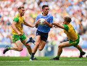 14 July 2018; Niall Scully of Dublin escapes the tackle of Hugh McFadden of Donegal on his way to scoring his side's first goal during the GAA Football All-Ireland Senior Championship Quarter-Final Group 2 Phase 1 match between Dublin and Donegal at Croke Park in Dublin. Photo by David Fitzgerald/Sportsfile