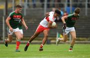 14 July 2018; Caullm Brown of Derry in action against Jordan Flynn, left, and Brian O'Malley during the EirGrid GAA Football All-Ireland U20 Championship Semi-Final match between Mayo and Derry at Páirc Seán Mac Diarmada, in Carrick-on-Shannon. Photo by Piaras Ó Mídheach/Sportsfile