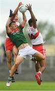 14 July 2018; Evan O'Brien of Mayo in action against Dara Rafferty, left, and Callum Brown of Derry during the EirGrid GAA Football All-Ireland U20 Championship Semi-Final match between Mayo and Derry at Páirc Seán Mac Diarmada, in Carrick-on-Shannon. Photo by Piaras Ó Mídheach/Sportsfile
