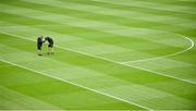 15 July 2018; Croke Park groundstaff Enda Colfer, left, and Colm Daly tend to the pitch before the GAA Football All-Ireland Senior Championship Quarter-Final Group 1 Phase 1 match between Kildare and Monaghan at Croke Park, Dublin. Photo by Piaras Ó Mídheach/Sportsfile