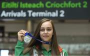 16 July 2018; Ireland's Sommer Lecky of Finn Valley AC, Co Donegal, with her silver medal she won in the women's high jump event during the Team Ireland homecoming from the IAAF World U20 Athletics Championships in Tampere, Finland, at Dublin Airport in Dublin. Photo by Piaras Ó Mídheach/Sportsfile