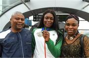 16 July 2018; Ireland's Patience Jumbo-Gula of St Gerard’s AC, Dundalk, Co Louth, with her parents Paul and Imeoma during the Team Ireland homecoming from the IAAF World U20 Athletics Championships in Tampere, Finland, at Dublin Airport in Dublin. Photo by Piaras Ó Mídheach/Sportsfile