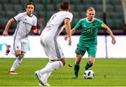 17 July 2018: Conor McCormack of Cork City in action against Miroslav Radovic of Legia Warsaw during the UEFA Champions League 1st Qualifying Round Second Leg match between Legia Warsaw and Cork City at the Polish Army Stadium in Warsaw, Poland. Photo by Lukasz Grochala/Sportsfile