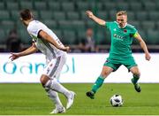 17 July 2018: Conor McCormack of Cork City in action against Mateusz Wieteska of Legia Warsaw during the UEFA Champions League 1st Qualifying Round Second Leg match between Legia Warsaw and Cork City at the Polish Army Stadium in Warsaw, Poland. Photo by Lukasz Grochala/Sportsfile