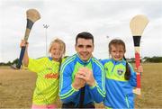 19 July 2018; Dublin hurler Danny Sutcliffe surprised youngsters, including Katie Brady, age 6, left, and Ruth Howard, age 6, taking part in one of the county’s most popular Kellogg’s GAA Cúl Camps with a visit to Éire Óg in Wicklow recently. Danny joined in what was an action-packed morning of activity and fun, teaching the children GAA skills, sharing great insider tips and promoting the importance of active play. More than 142,000 children took part in Kellogg’s GAA Cúl Camps last year.  The camps are for children aged 6 – 13 years who can enjoy a week of on-the-pitch action learning new skills, making new friends, being active and having fun during the school holidays in July and August. Kellogg’s involvement with Cúl Camps stems from its commitment to promoting and encouraging physical activity.  Educating children on the importance of nutrition to support active play is a key component of Cúl Camps and Kellogg’s believes in the power of breakfast to fuel activity both on and off the pitch. The camps are in full swing and surprise visits will take place across all provinces during the summer. For more information parents can log on to www.kelloggsculcamps.gaa.ie Photo by Stephen McCarthy/Sportsfile