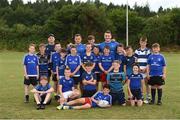 18 July 2018; Leinster player's Bryan Byrne and Peter Dooley with Leinster summer camp coach Tadhg Kellaher  with kids from the summer camp during the Bank of Ireland Leinster Rugby Summer Camp at Portlaoise RFC, Togher, Portlaoise, Co. Laois. Photo by Matt Browne/Sportsfile