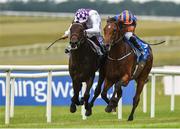 21 July 2018; Guaranteed, left, with Kevin Manning up, on their way to winning the Club Godolphin Irish EBF Maiden from second place, Mount Tabora, with Ryan Moore up, during Irish Oaks Day at the Curragh Racecourse in Kildare. Photo by Matt Browne/Sportsfile