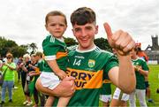 21 July 2018; Lee O'Donoghue of Kerry celebrates with his nephew Jacob O'Donoghue, aged 18 months, after the GAA Football All-Ireland Junior Championship Final match between Kerry and Galway at Cusack Park in Ennis, Co. Clare. Photo by Diarmuid Greene/Sportsfile