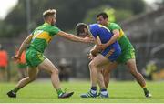 21 July 2018; Cathal Cregg of Roscommon is tackled by Stephen McMenamin, left, and Frank McGlynn of Donegal during the GAA Football All-Ireland Senior Championship Quarter-Final Group 2 Phase 2 match between Roscommon and Donegal at Dr Hyde Park in Roscommon. Photo by Ramsey Cardy/Sportsfile