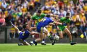 21 July 2018; Jamie Brennan of Donegal has a shot on goal despite the attention of Tadhg O'Rourke of Roscommon during the GAA Football All-Ireland Senior Championship Quarter-Final Group 2 Phase 2 match between Roscommon and Donegal at Dr Hyde Park in Roscommon. Photo by David Fitzgerald/Sportsfile