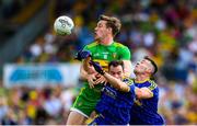 21 July 2018; Hugh McFadden of Donegal in action against Niall Kilroy, left, and John McManus of Roscommon during the GAA Football All-Ireland Senior Championship Quarter-Final Group 2 Phase 2 match between Roscommon and Donegal at Dr Hyde Park in Roscommon. Photo by David Fitzgerald/Sportsfile