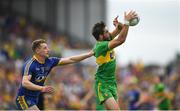 21 July 2018; Odhrán Mac Niallais of Donegal in action against Niall McInerney of Roscommon during the GAA Football All-Ireland Senior Championship Quarter-Final Group 2 Phase 2 match between Roscommon and Donegal at Dr Hyde Park in Roscommon. Photo by Ramsey Cardy/Sportsfile