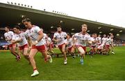 21 July 2018; Tyrone players break from the team photograph prior to the GAA Football All-Ireland Senior Championship Quarter-Final Group 2 Phase 2 match between Tyrone and Dublin at Healy Park in Omagh, Tyrone. Photo by Stephen McCarthy/Sportsfile