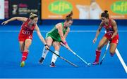 21 July 2018; Lizzie Colvin of Ireland holds off the challenge of Kathleen Sharkey, left, and Melissa Gonzalez of the USA during the Women's Hockey World Cup Finals Group B match between Ireland and USA at Lee Valley Hockey Centre in QE Olympic Park, London, England.  Photo by Craig Mercer/Sportsfile
