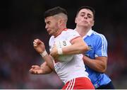 21 July 2018; Richard Donnelly of Tyrone in action against Brian Howard of Dublin during the GAA Football All-Ireland Senior Championship Quarter-Final Group 2 Phase 2 match between Tyrone and Dublin at Healy Park in Omagh, Tyrone. Photo by Stephen McCarthy/Sportsfile