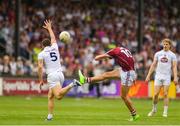 22 July 2018; Michael Daly of Galway kicks a point, despite the attention of Johnny Byrne of Kildare during the GAA Football All-Ireland Senior Championship Quarter-Final Group 1 Phase 2 match between Kildare and Galway at St Conleth's Park in Newbridge, Co Kildare. Photo by Sam Barnes/Sportsfile