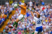 22 July 2018; Brian Kelly of Kerry beats Kieran Hughes of Monaghan to the ball during the GAA Football All-Ireland Senior Championship Quarter-Final Group 1 Phase 2 match between Monaghan and Kerry at St Tiernach's Park in Clones, Monaghan. Photo by Ramsey Cardy/Sportsfile
