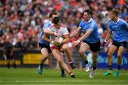 21 July 2018; Richard Donnelly of Tyrone  in action against Jack McCaffrey, left, Philly McMahon of Dublin  during the GAA Football All-Ireland Senior Championship Quarter-Final Group 2 Phase 2 match between Tyrone and Dublin at Healy Park in Omagh, Tyrone. Photo by Ray McManus/Sportsfile