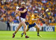 14 July 2018; Liam Ryan of Wexford in action against Shane O'Donnell of Clare during the GAA Hurling All-Ireland Senior Championship Quarter-Final match between Clare and Wexford at Páirc Ui Chaoimh in Cork. Photo by Brendan Moran/Sportsfile