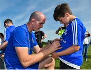 25 July 2018; Leinster's Devin Toner signs a jersey for a camp participant during the Bank of Ireland Leinster Rugby Summer Camp at Cill Dara RFC, in Kildare. Photo by Seb Daly/Sportsfile