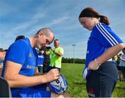 25 July 2018; Leinster's Devin Toner signs a ball for a camp participant during the Bank of Ireland Leinster Rugby Summer Camp at Cill Dara RFC in Kildare. Photo by Seb Daly/Sportsfile