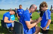 25 July 2018; Leinster's Jack Conan, left, and Devin Toner sign a jerseys for a camp participants during the Bank of Ireland Leinster Rugby Summer Camp at Cill Dara RFC in Kildare. Photo by Seb Daly/Sportsfile