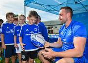 25 July 2018; Leinster's Jack Conan signs a ball for a camp participant during the Bank of Ireland Leinster Rugby Summer Camp at Cill Dara RFC in Kildare. Photo by Seb Daly/Sportsfile