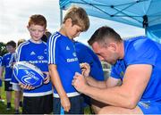 25 July 2018; Leinster's Jack Conan signs a jersey for a camp participant during the Bank of Ireland Leinster Rugby Summer Camp at Cill Dara RFC in Kildare. Photo by Seb Daly/Sportsfile