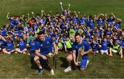 25 July 2018; Leinster players James Ryan and Andrew Porter with camp participants during the Bank of Ireland Leinster Rugby Summer Camp at Clondalkin RFC in Dublin. Photo by David Fitzgerald/Sportsfile