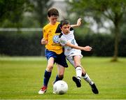 28 July 2018; Luke Nolan of Crumlin United, right, in action against Shain Cleary of Portumna Town, during Ireland's premier underaged soccer tournament, the Volkswagen Junior Masters. The competition sees U13 teams from around Ireland compete for the title and a €2,500 prize for their club, over the days of July 28th and 29th, at AUL Complex in Dublin. Photo by Seb Daly/Sportsfile