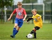 28 July 2018; Eoghan Brady of Aisling Annacotty in action against Liam Murphy of Knocknacarra, during Ireland's premier underaged soccer tournament, the Volkswagen Junior Masters. The competition sees U13 teams from around Ireland compete for the title and a €2,500 prize for their club, over the days of July 28th and 29th, at AUL Complex in Dublin. Photo by Seb Daly/Sportsfile