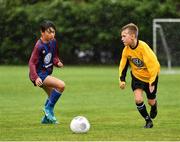28 July 2018; Cathal Downes of Aisling Annacotty, right, in action against Alex Divine of East Meath United, during Ireland's premier underaged soccer tournament, the Volkswagen Junior Masters. The competition sees U13 teams from around Ireland compete for the title and a €2,500 prize for their club, over the days of July 28th and 29th, at AUL Complex in Dublin. Photo by Seb Daly/Sportsfile